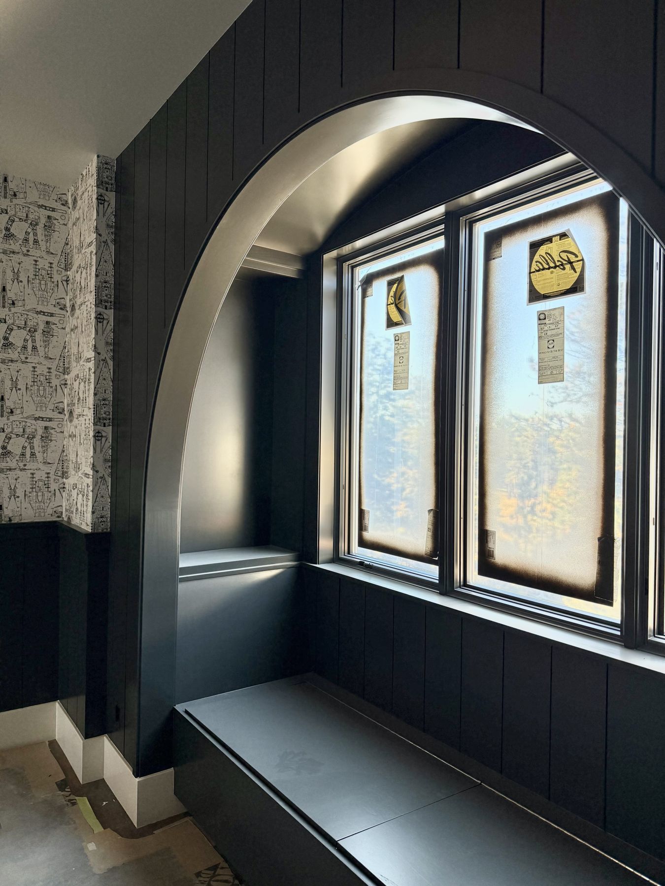 Arched window seat with navy beadboard