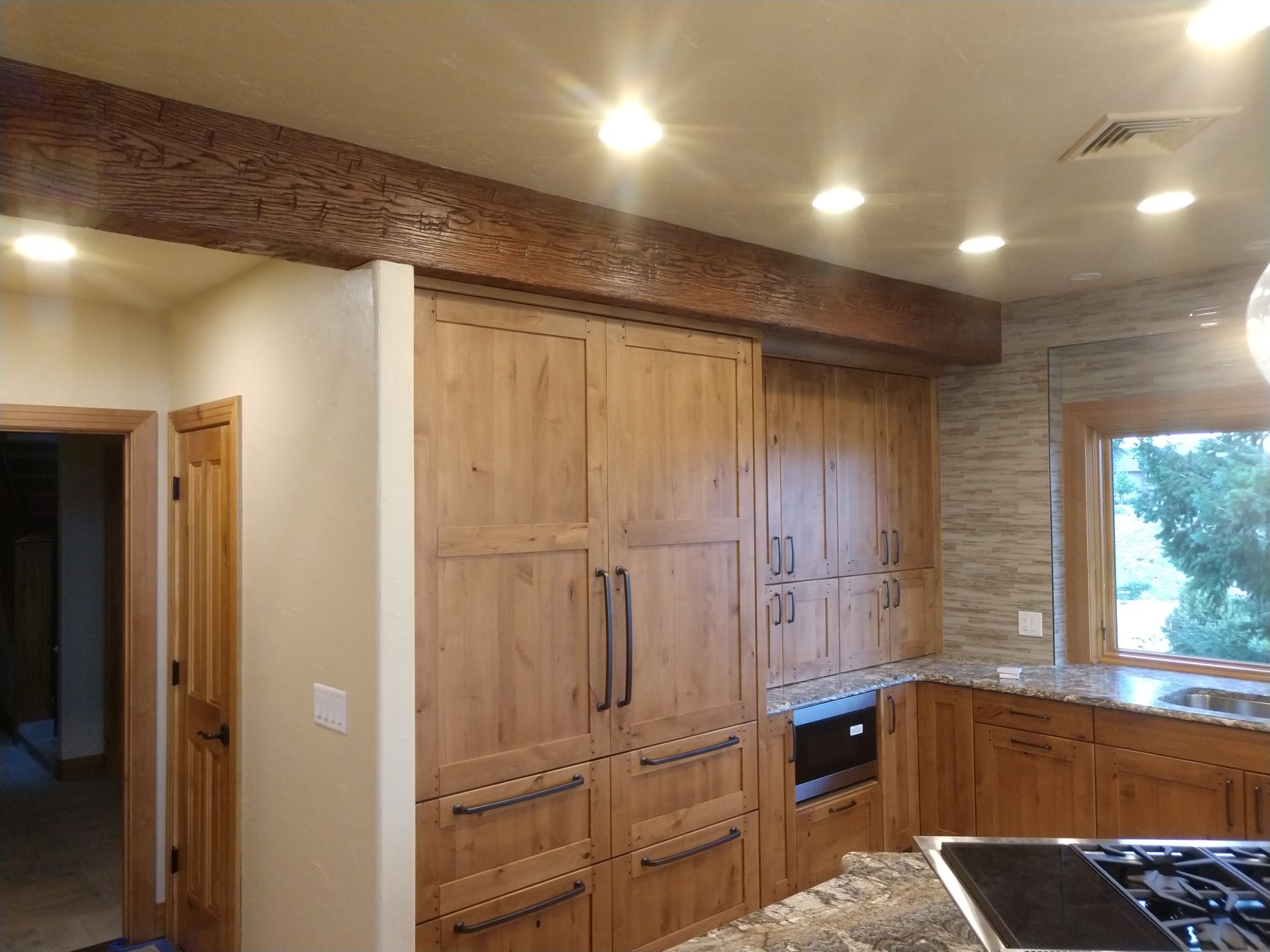 Knotty alder kitchen cabinetry